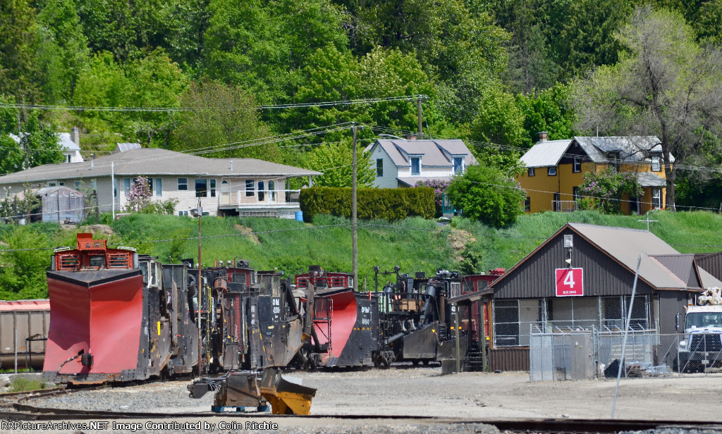 A herd of CP Rail snowplows and spreaders in the south storage area on the CP Revelstoke Yard.